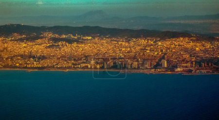 flying over Barcelona city view from the sea