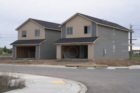 Duplex homes under construction in new residential area.