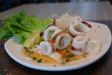 Spicy squid, squid rings, spicy squid salad are a very tasty healthy dish. High quality photo