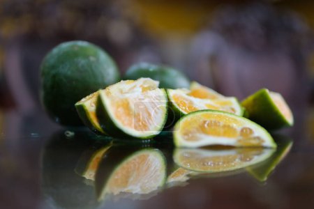 Half a tangerine used for fresh orange juice. green orange Half a tangerine used for fresh orange juice. High quality photo