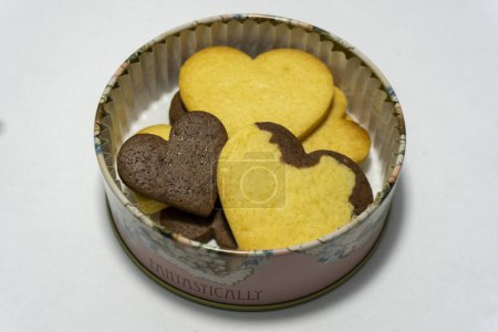 heart-shaped cookies in a tin