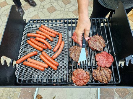 Overhead food flat lay grilling out hotdogs and hamburger. 