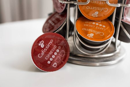 Photo for Coffee machine capsules Tchibo Cafissimo on the table and on the capsule stand - Royalty Free Image