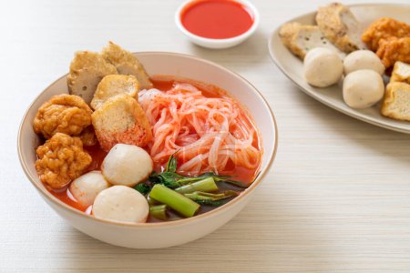 Photo for Small flat rice noodles with fish balls and shrimp balls in pink soup, Yen Ta Four or Yen Ta Fo - Asian food style - Royalty Free Image