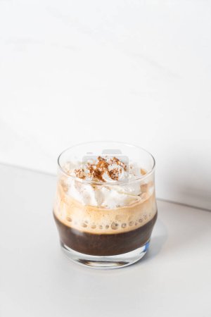 Coffee with Irish whiskey and whipped cream in glass - Irish coffee