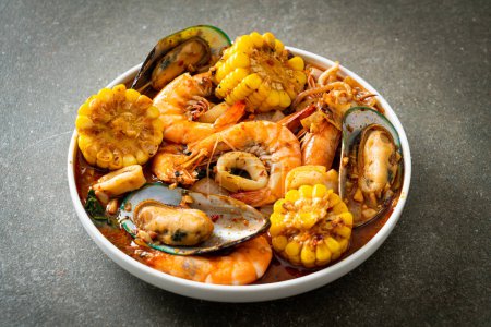 spicy barbecue seafood - shrimps, sqiud, mussel and corn