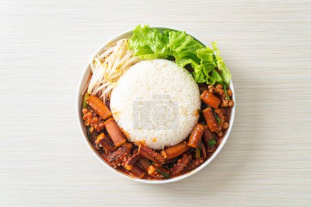 Photo for Ojing-O-Bokeum - Stir-fried squid or octopus with Korean spicy sauce rice bowl - Korean food style - Royalty Free Image