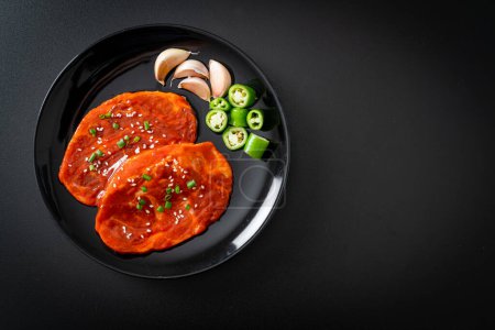 Photo for Pork Korean marinated or fresh pork raw marinated with Korean spicy paste for grilling in Korean style - Royalty Free Image