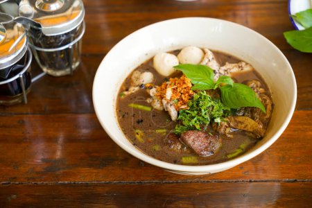 Photo for Thai boat noodles - Thai noodle with pork in blood soup - Royalty Free Image