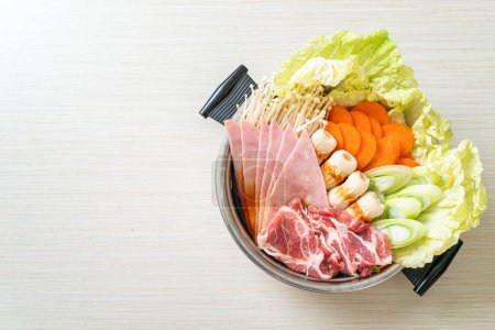 Photo for Sukiyaki or shabu hot pot black soup with meat raw and vegetable - Japanese food style - Royalty Free Image