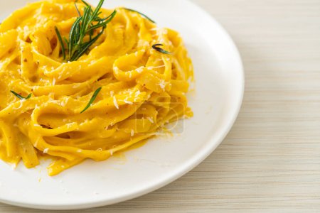 Photo for Fettuccine spaghetti pasta with butternut pumpkin creamy sauce - Royalty Free Image