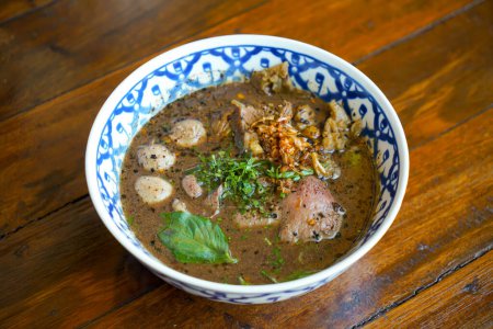 Photo for Thai boat noodles with wagyu - Thai noodle with beef in blood soup - Royalty Free Image