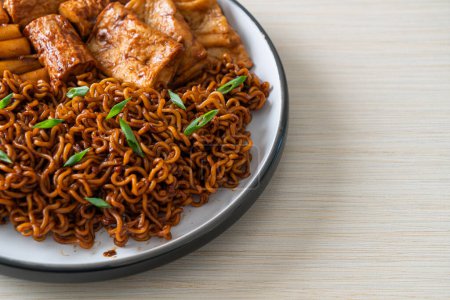 Photo for Jajangmyeon or JJajangmyeon with Odeng and Omuk - Korean Instant noodles with Korean fish cake in black bean sauce - Korean food style - Royalty Free Image
