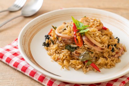 Photo for Homemade Basil and Spicy Herb Fried Rice with Squid or Octopus - Asian food style - Royalty Free Image