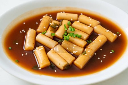 Photo for Spicy Jjajang Tteokbokki or Korean rice cake in spicy black bean sauce - Korean food style - Royalty Free Image