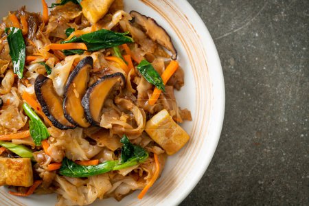 stir-fried noodles with tofu and vegetables - vegan and vegetarian food style