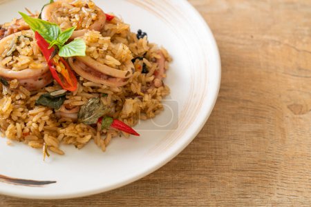 Photo for Homemade Basil and Spicy Herb Fried Rice with Squid or Octopus - Asian food style - Royalty Free Image