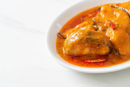 Photo for Redtail Catfish Fish in Dried Red Curry Sauce that called Choo Chee or a king of curry cooked with fish served with a spicy sauce - Royalty Free Image