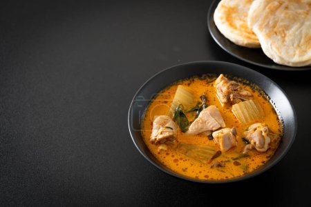 Chicken curry soup with roti or naan with chicken tikka masala - Asian food style