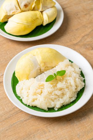 Durian with sticky rice -  sweet durian peel with yellow bean, Ripe durian rice cooked with coconut milk - Asian Thai dessert summer tropical fruit food