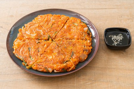 Korean Kimchi pancake or Kimchijeon - Fried Mixed Egg, Kimchi, and Flour - Korean food style