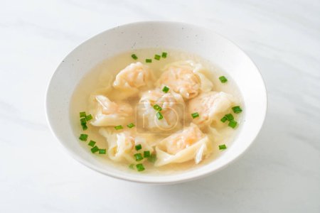 shrimp dumpling soup in white bowl - Asian food style