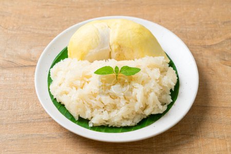 Durian with sticky rice -  sweet durian peel with yellow bean, Ripe durian rice cooked with coconut milk - Asian Thai dessert summer tropical fruit food