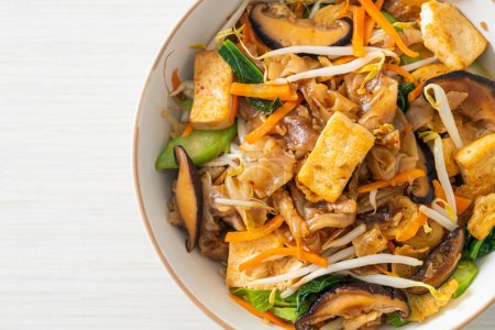 stir-fried noodles with tofu and vegetables - vegan and vegetarian food style