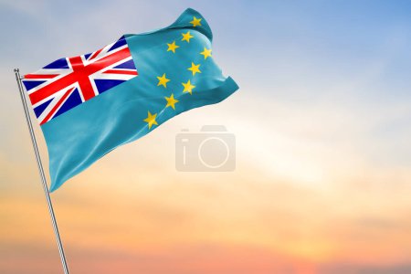 beau drapeau de tuvalu dans le vent sur le fond du coucher de soleil, vue sur le concept. place pour le texte.