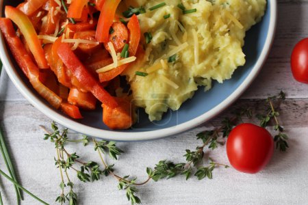 Comfort Fusion: Cheesy Mashed Potato Sausage Stew with Vibrant Bell Peppers, Tomatoes, and Fresh Thyme