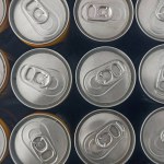 Neatly arranged beverage cans. Aluminum, metal cans for soda, milk, and energy drinks. Recyclable beverage cans
