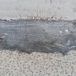old cement floor. The floor is patched with cement