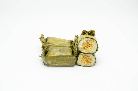 Indonesian tradisional food called lemper made from steamed glutinous rice with chicken floss wrapped in banana leaves.