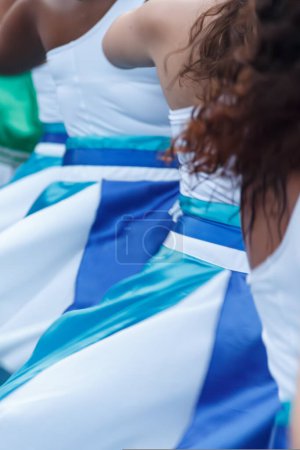 Women from Maracatu, a Brazilian cultural and religious artistic activity, holding hands in a gesture of peace, celebration, respect and friendship