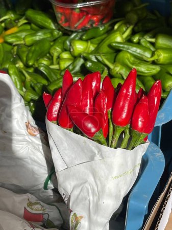 fresh red chili peppers in a market