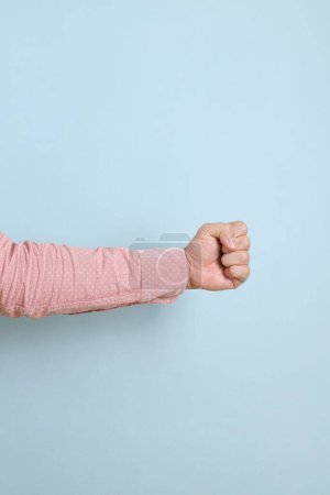 Photo for Close up hands of  asian male hand gesture of  measure symbol isolated on pink background. - Royalty Free Image