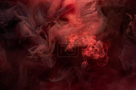 Foto de Tinta roja fondo abstracto. Fondo de pintura acrílica para perfume, narguile, cosméticos. Misteriosas nubes de humo, niebla colorida - Imagen libre de derechos