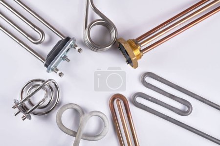 Photo for Set of different types Tubular electric Heating elements made of steel for washing machines, boiling water, heating, isolated on white background - Royalty Free Image