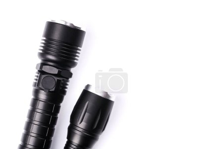 Foto de Set de linternas tácticas de bolsillo negro aisladas sobre fondo blanco - Imagen libre de derechos