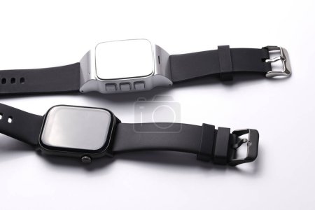 Photo for Wireless electronic smart watch with Touch Screen close-up isolated on white background. Bluetooth Bracelet, black band fitness tracker - Royalty Free Image