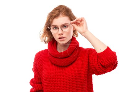 Photo for Redhead young woman wearing glasses squinting while looking at camera isolated on white background. Vision problems concept - Royalty Free Image