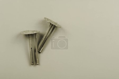 Photo for Plastic anchor bolts, fixing dowel isolated on gray background - Royalty Free Image