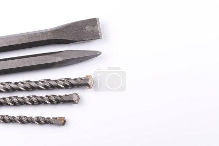 Photo for Metal chisel and drill bits on concrete for perforator isolated on white background - Royalty Free Image