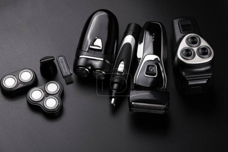 Photo for Different types of men's electric razor closeup isolated on black background - Royalty Free Image