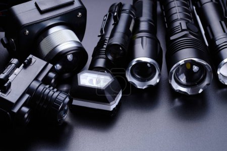 Photo for Set of black pocket tactical flashlights isolated on black background - Royalty Free Image