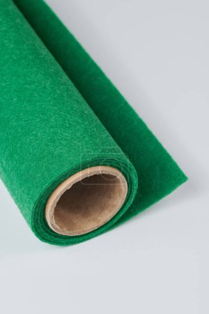 Foto de Soft felt textile material Classic Green colors, colorful texture fabric roll closeup - Imagen libre de derechos