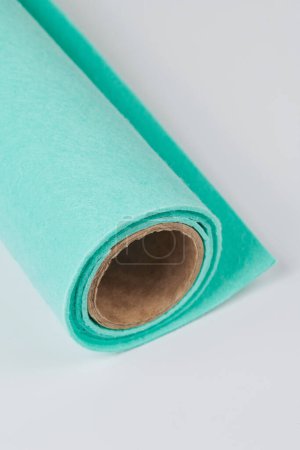 Photo for Soft felt textile material turquoise colors, colorful texture fabric roll closeup - Royalty Free Image