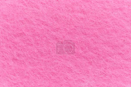 Téléchargez les photos : Soft felt textile material pink color, colorful texture flap fabric background closeup - en image libre de droit
