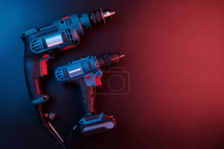 Photo for Set of new power tools isolated on a black background, drill, puncher, electric saw, jigsaw, circular saw - Royalty Free Image