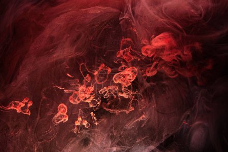 Photo for Red black ink abstract background. Acrylic paint backdrop for perfume, hookah, cosmetics. Mysterious smoke clouds, colorful fog - Royalty Free Image